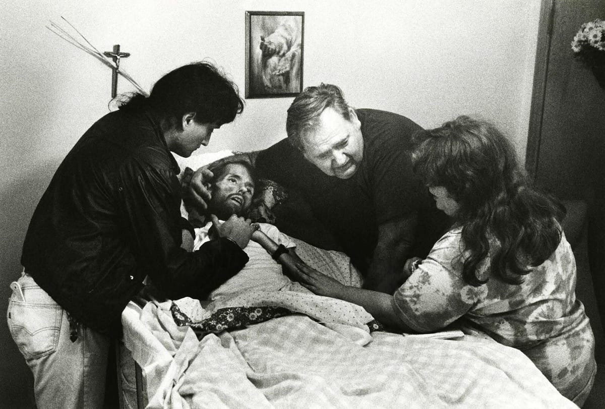David Kirby, on his death bed, surrounded by family.